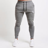 Pantalon de jogging pour homme Fitness Pantalon de survêtement sportif pour homme Sportswear Bas Pantalon de survêtement skinny Pantalon noir Pantalon de survêtement noir Jogger